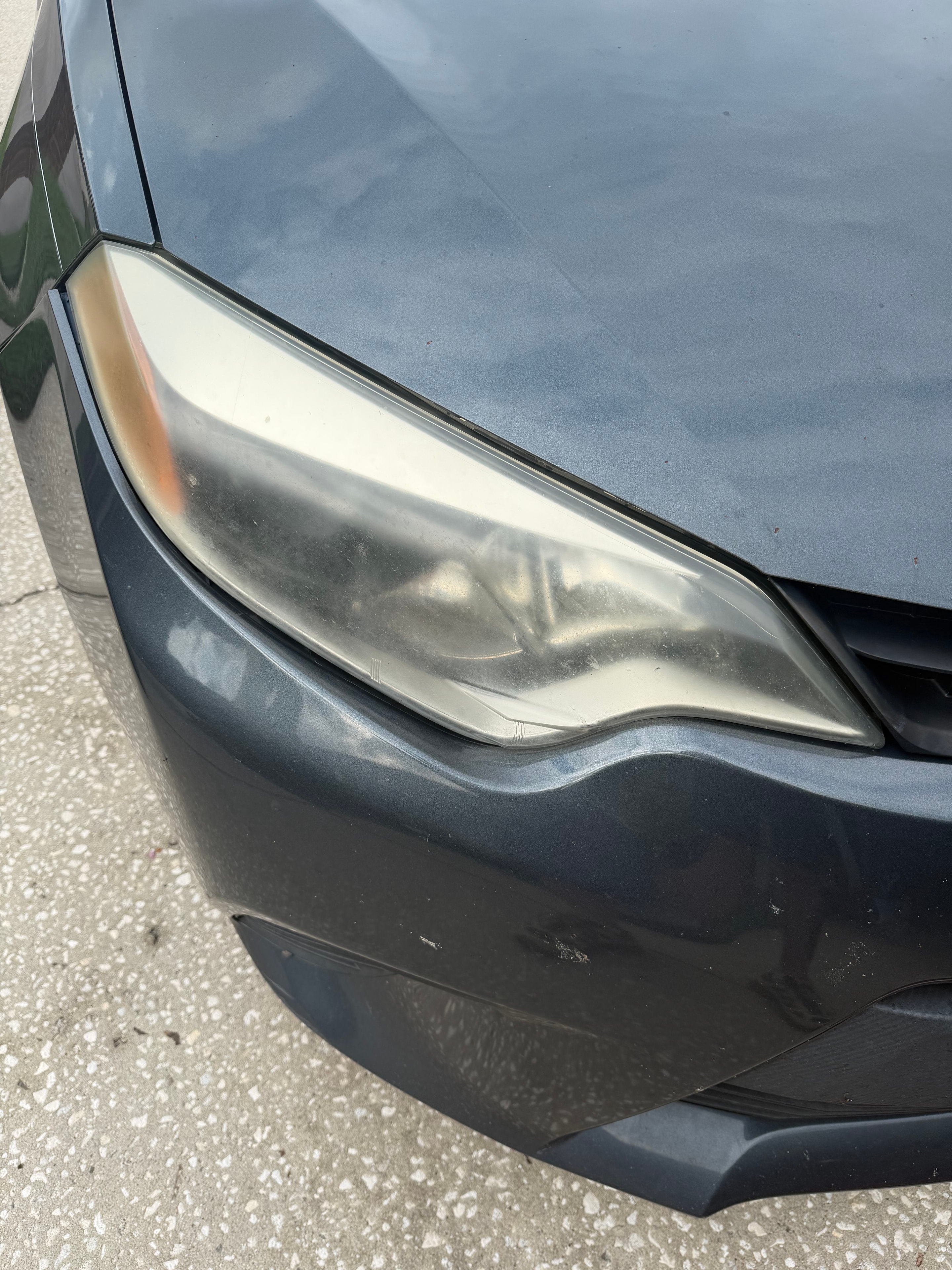 Cloudy Corolla headlight before restoration